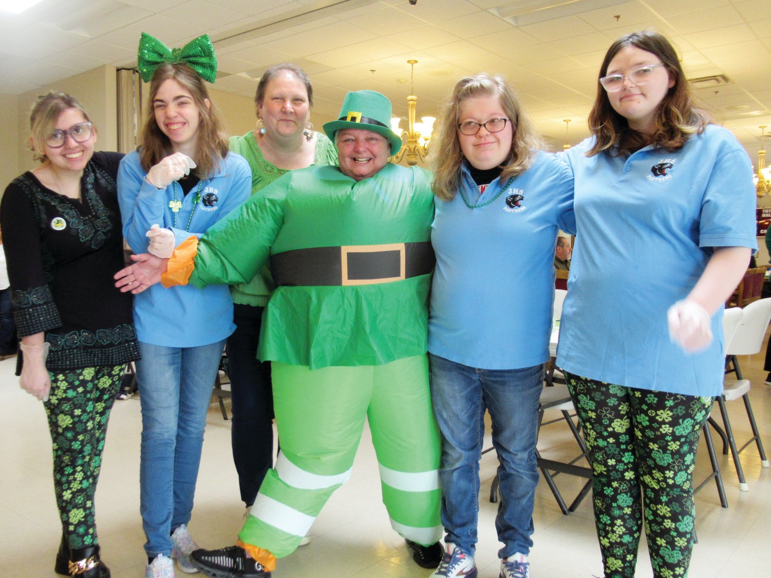 SUPER SERVERS: Singing sensation Katie Rodriguez (left) is joined by her JHS classmates Kayla Beaudry, Avery Ream and Hayden Judd as well as Louise Stanielon and “Leprechaun” Jackie Pion during last week’s JSC St. Patrick’s Day Party.